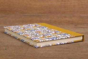 Notebook with blank pages and a floral pattern